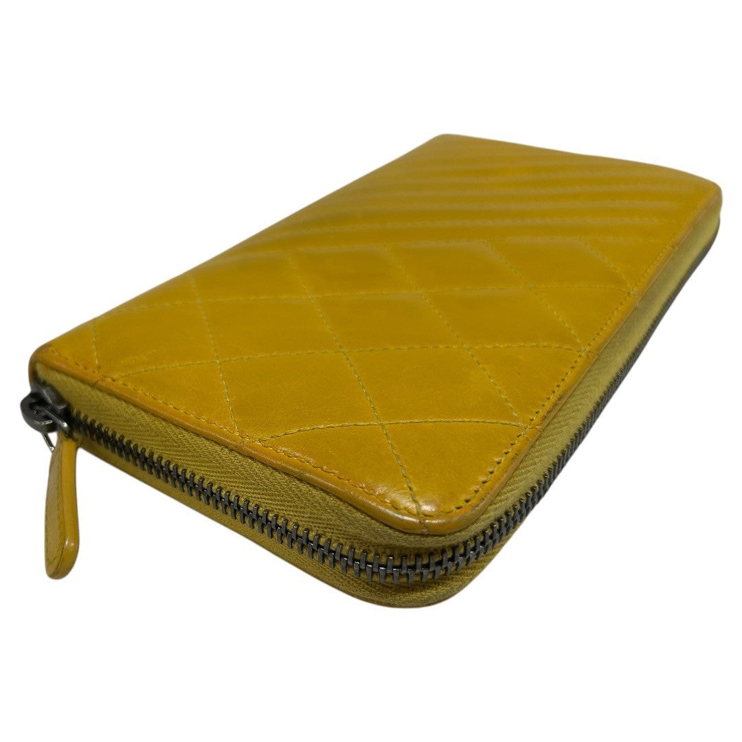 CHANEL Round zipper wallet yellow
