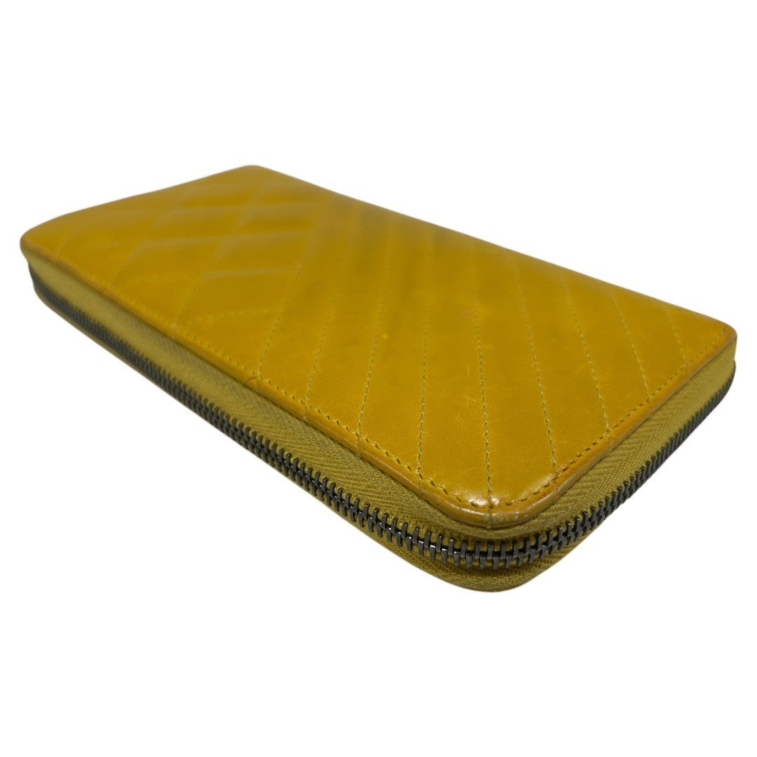 CHANEL Round zipper wallet yellow