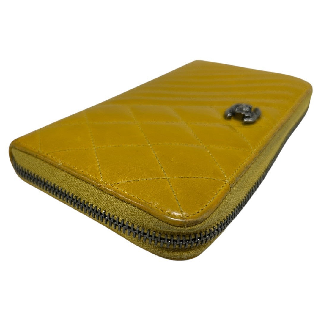 CHANEL Round zipper wallet yellow