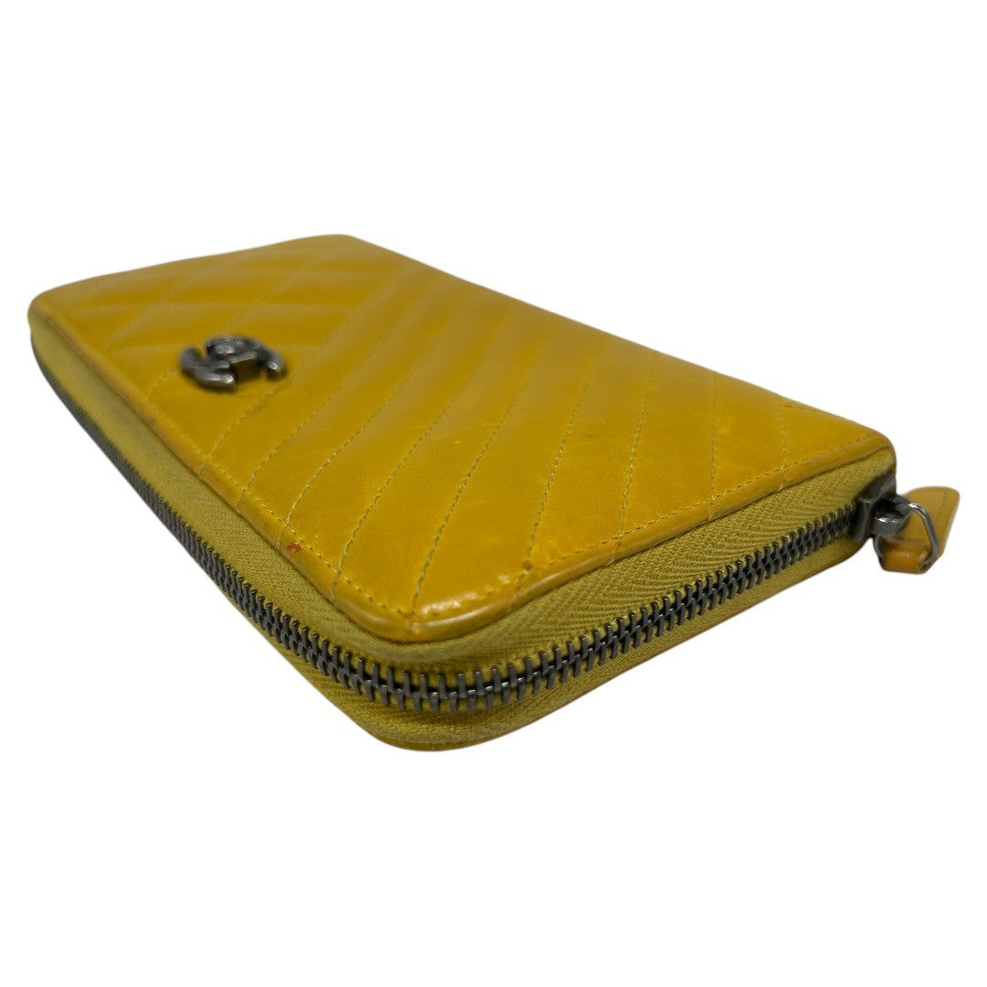 CHANEL Round zipper wallet yellow