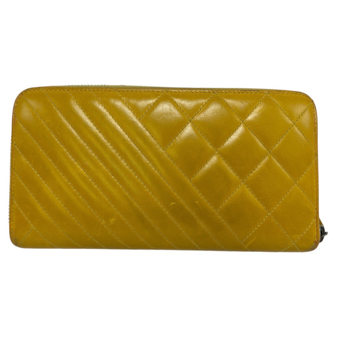 CHANEL Round zipper wallet yellow