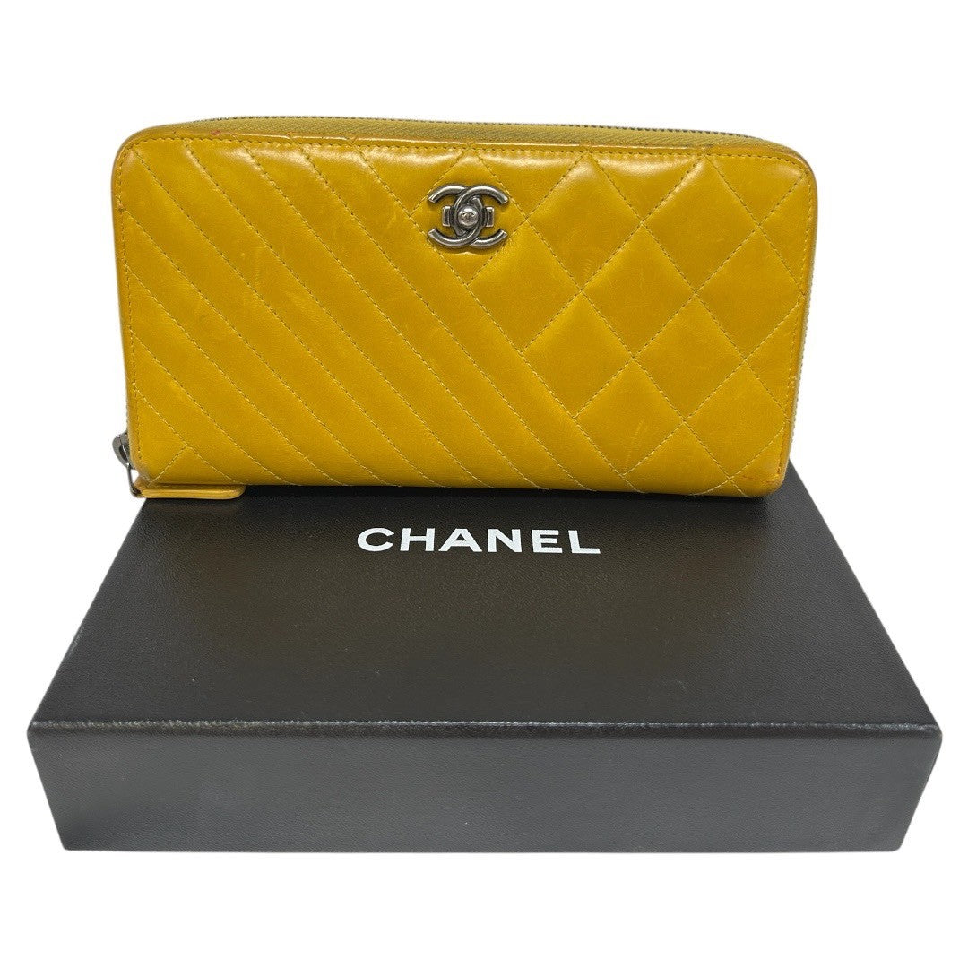 CHANEL Round zipper wallet yellow
