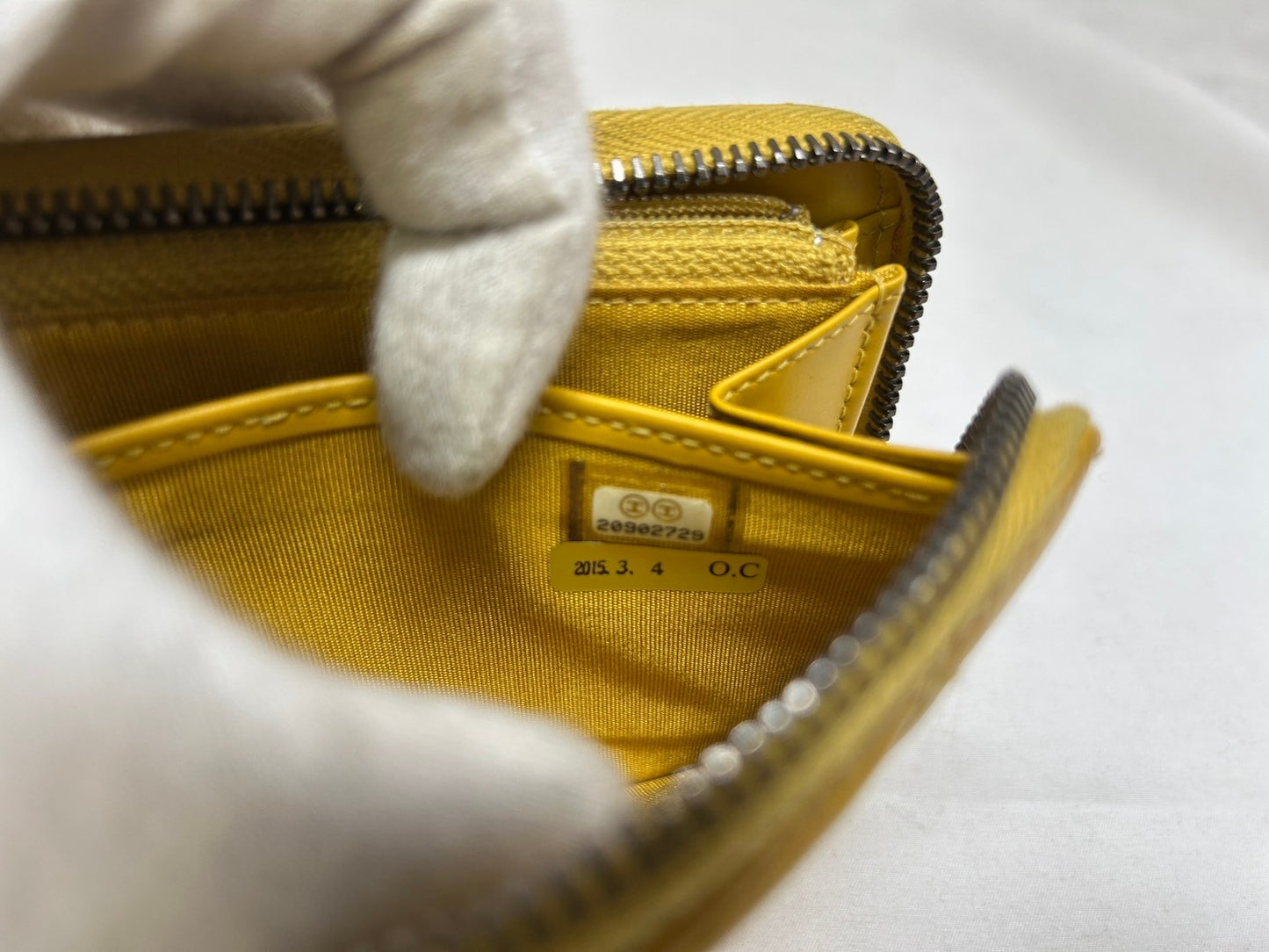 CHANEL Round zipper wallet yellow