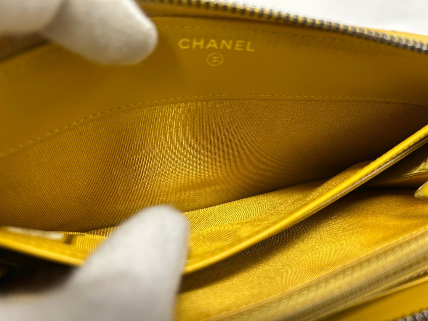 CHANEL Round zipper wallet yellow