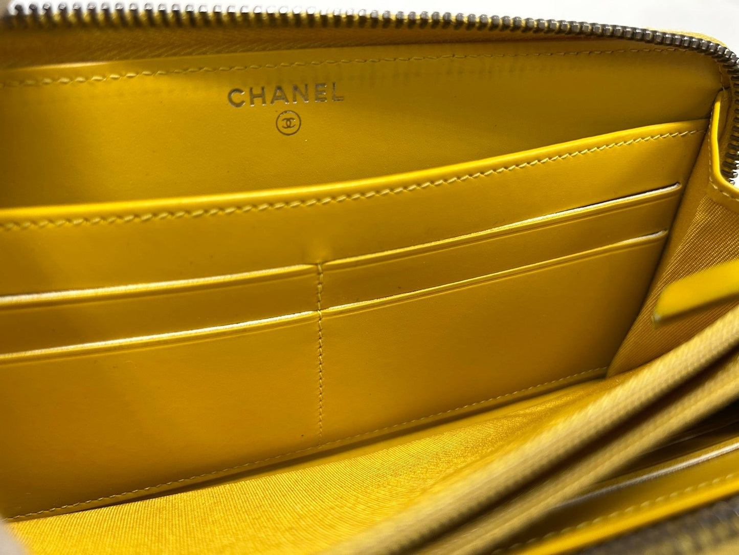 CHANEL Round zipper wallet yellow